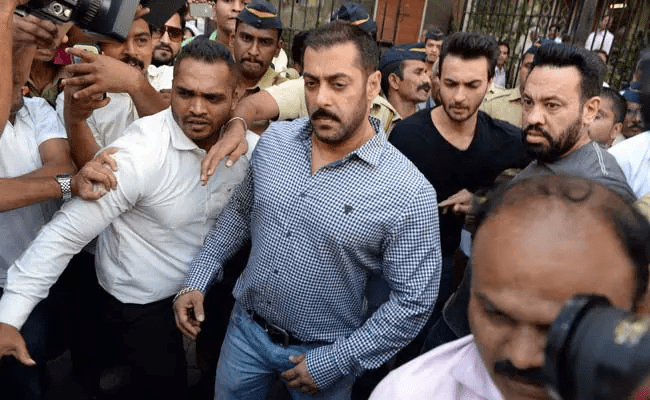 Salman Khan surrounded by police and media during court appearance in 2002 hit and run case