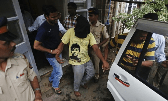 Sujatha Nikajle escorted by Mumbai Police during arrest case proceedings