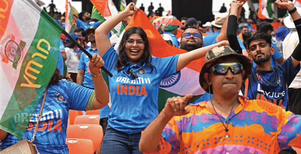 Local spectators watching district cricket match with community enthusiasm