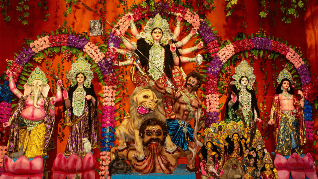 Devotees performing Navratri aarti in temple filled with lamps and flowers
