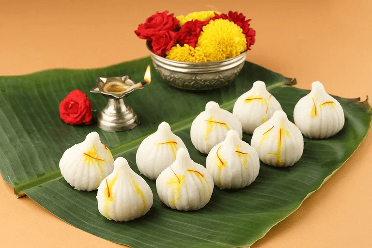 Modaks and laddus offered to Lord Ganesha during sacred healing rituals