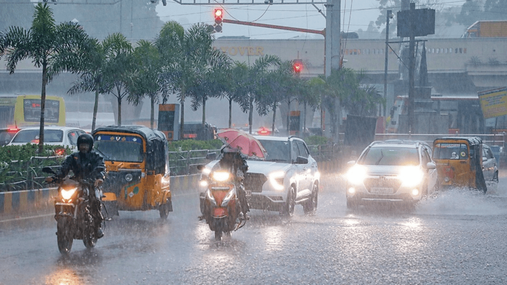 Chennai city traffic during heavy rain as vehicles move through waterlogged streets