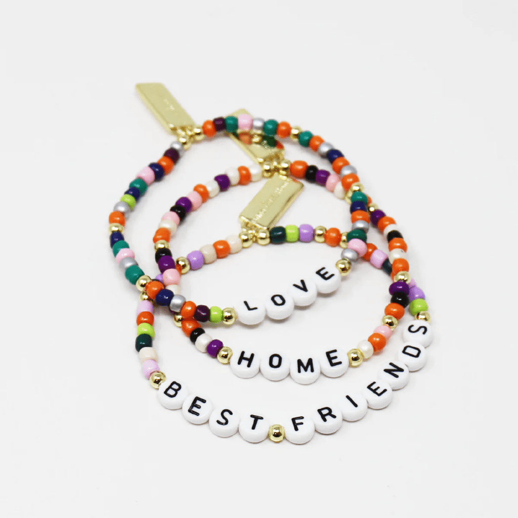 Young friends wearing friendship bands as a symbol of close bonds