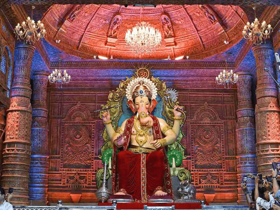Public Ganesh Chaturthi pandal with devotees gathered in celebration