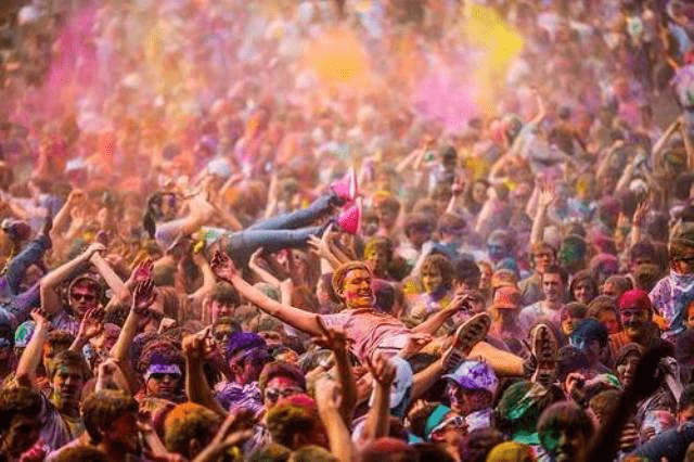 People celebrating Holi in India with vibrant colors and joy